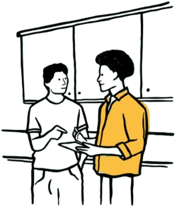 Two people chatting by some cupboards